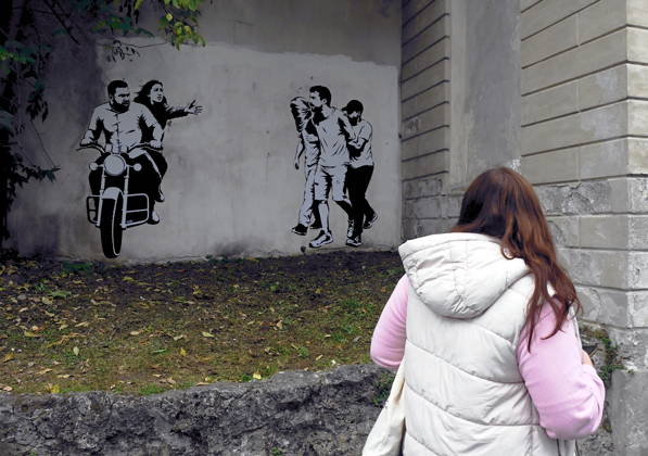 IPA89393684 - MILAN - October 7, 2026 - A mural by Alexandro Palombo, an artwork on display on October 7 at the Museum of Modern Art, located at 16 Via Palestro, dedicated to the young couple kidnapped during the attack on the Nova Music Festival Copyright: xMaurizioxMaulex xMaurizioxMaulex IPA89393684