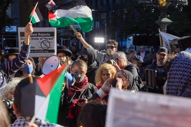 October 7, 2026, New York, New York, USA: A protester raises a megaphone as demonstrators hold flags and signs during a pro-Palestinian rally at City Hall Park in New York City, New York. New York USA - ZUMAs237 20261007_aap_s237_005 Copyright: xMarkxJ.xSullivanx