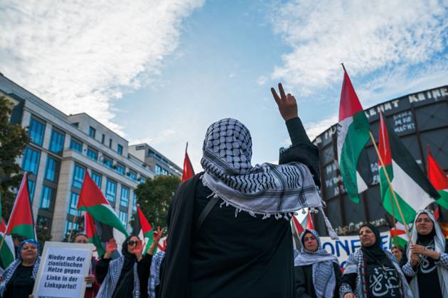 October 7, 2026, Berlin, Berlin, Germany: BERLIN, GERMANY, OCTOBER 7, 2026: Demonstrators gather at Checkpoint Charlie in central Berlin to mark three years since the start of the Gaza war. Participants protest against Israelâ€⠢s military actions in Gaza, which they describe as genocide, and express solidarity with Palestinians. Berlin Germany - ZUMAq101 20261007_zna_q101_407 Copyright: xNikosxKanistrasx