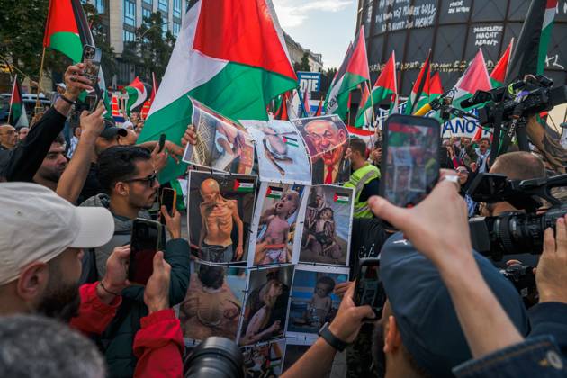 October 7, 2026, Berlin, Berlin, Germany: BERLIN, GERMANY, OCTOBER 7, 2026: Demonstrators gather at Checkpoint Charlie in central Berlin to mark three years since the start of the Gaza war. Participants protest against Israelâ€⠢s military actions in Gaza, which they describe as genocide, and express solidarity with Palestinians. Berlin Germany - ZUMAq101 20261007_zna_q101_409 Copyright: xNikosxKanistrasx