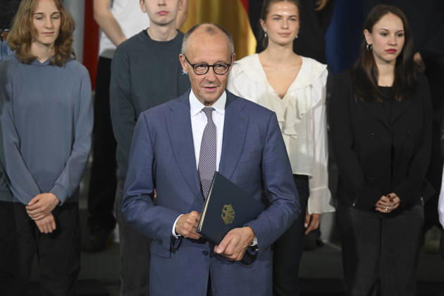 German Chancellor Friedrich Merz, British Prime Minister Andy Burnham attend Kensington Treaty ratification ceremony in Berlin BERLIN, GERMANY - OCTOBER 08: German Chancellor Friedrich Merz holds a document during a ceremony marking the exchange of instruments of ratification of the Kensington Treaty at the Federal Chancellery in Berlin, Germany, on October 08, 2026. British Prime Minister Andy Burnham and high school students also attend the ceremony. Halil Sagirkaya Anadolu Berlin Germany. Editorial use only. Please get in touch for any other usage. Copyright: x2026xAnadoluxHalilxSagirkayax