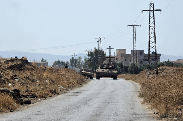 Israeli army conducts raids in Syria s Quneitra countryside QUNEITRA, SYRIA - OCTOBER 8: Israeli forces patrol the village with tanks as they conduct raids in residential areas and fire harassment shots at open areas in the countryside of Quneitra, southern Syria, on October 8, 2026. Huseyin Mesal Anadolu Quneitra Syria. Editorial use only. Please get in touch for any other usage. Copyright: x2026xAnadoluxHuseyinxMesalx