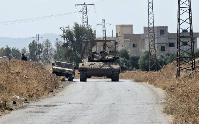 Israeli army conducts raids in Syria s Quneitra countryside QUNEITRA, SYRIA - OCTOBER 8: Israeli forces patrol the village with tanks as they conduct raids in residential areas and fire harassment shots at open areas in the countryside of Quneitra, southern Syria, on October 8, 2026. Huseyin Mesal Anadolu Quneitra Syria. Editorial use only. Please get in touch for any other usage. Copyright: x2026xAnadoluxHuseyinxMesalx