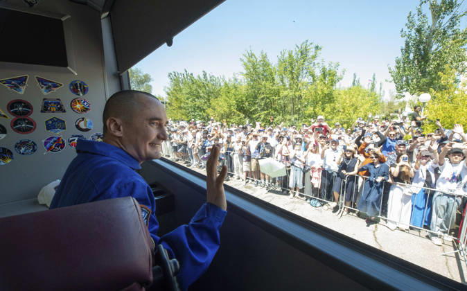 October 8, 2026, Baikonur, Kazakhstan: Baikonur, Kazakhstan. 14 July, 2026. Roscosmos cosmonaut Pyotr Dubrov waves from the bus as he and crewmates Anil Menon and Anna Kikina depart the Cosmonaut Hotel for suit-up, July 14, 2026 in Baikonur, Kazakhstan. The crew launched later that day to the International Space Station. Baikonur Kazakhstan - ZUMAp138 20261008_zaa_p138_005 Copyright: xPavelxShvets Gctcx