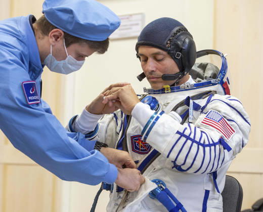 October 8, 2026, Baikonur, Kazakhstan: Baikonur, Kazakhstan. 14 July, 2026. NASA astronaut Anil Menon is helped into his Russian Sokol suit at the Baikonur Cosmodrome before the Expedition 75 launch, July 14, 2026 in Baikonur, Kazakhstan. He launched to the International Space Station later that day. Baikonur Kazakhstan - ZUMAp138 20261008_zaa_p138_009 Copyright: xPavelxShvets Gctcx