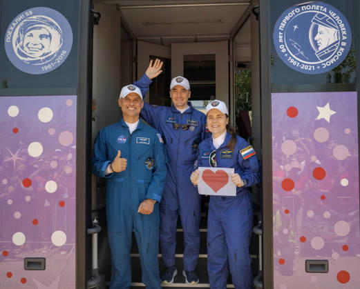 October 8, 2026, Baikonur, Kazakhstan: Baikonur, Kazakhstan. 14 July, 2026. NASA astronaut Anil Menon, left, and Roscosmos cosmonauts Pyotr Dubrov and Anna Kikina stand in the door of their bus as they depart the Cosmonaut Hotel for suit-up, July 14, 2026 in Baikonur, Kazakhstan. Kikina holds up a heart sign for well-wishers. Baikonur Kazakhstan - ZUMAp138 20261008_zaa_p138_016 Copyright: xBillxIngalls Nasax