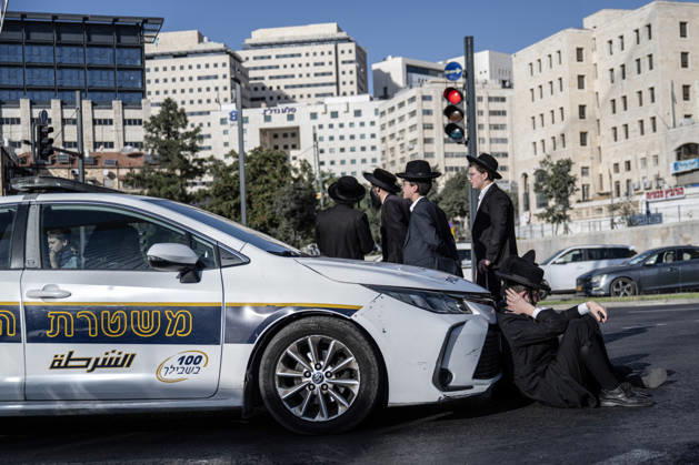 Anti-military service Ultra-Orthodox Jews block road to West Jerusalem JERUSALEM - OCTOBER 8: Israeli police deployed to the scene intervene against the demonstrators as Ultra-Orthodox Jews, known as Haredi, protest the lack of legislation exempting yeshiva students from mandatory military service and the detention of students on grounds of draft evasion in West Jerusalem, on October 8, 2026. Haredi protesters lie on the road leading to West Jerusalem and block traffic. Mostafa Alkharouf Anadolu Jerusalem Israel. Editorial use only. Please get in touch for any other usage.  Copyright: x2026xAnadoluxMostafaxAlkharoufx