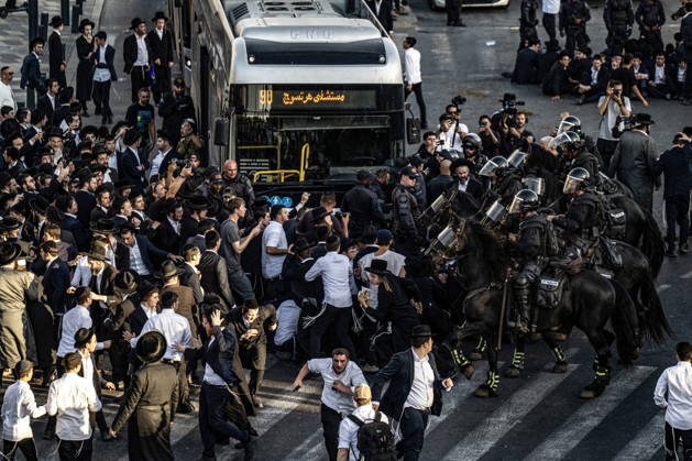 Anti-military service Ultra-Orthodox Jews block road to West Jerusalem JERUSALEM - OCTOBER 8: Mounted Israeli police officers on horseback deployed to the scene intervene against demonstrators as Ultra-Orthodox Jews, known as Haredi, protest the lack of legislation exempting yeshiva students from mandatory military service and the detention of students on grounds of draft evasion in West Jerusalem, Israel, on October 8, 2026. Haredi protesters lie on the road leading to West Jerusalem and block traffic. Mostafa Alkharouf Anadolu Jerusalem Israel. Editorial use only. Please get in touch for any other usage.  Copyright: x2026xAnadoluxMostafaxAlkharoufx
