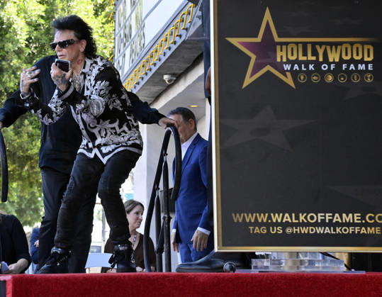 Russell Hitchcock of the rock duo Air Supply is introduced during an unveiling ceremony honoring the duo with the 2,859th star on the Hollywood Walk of Fame in Los Angeles on Thursday October 8, 2026. Looking on is David Foster (L) and Pat Sajak  LAP2026100801 JIMxRUYMEN