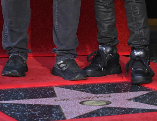 Graham Russel (L) and Russell Hitchcock stand next to their star during an unveiling ceremony honoring them with the 2,859th star on the Hollywood Walk of Fame in Los Angeles on Thursday October 8, 2026.  LAP2026100825 JIMxRUYMEN