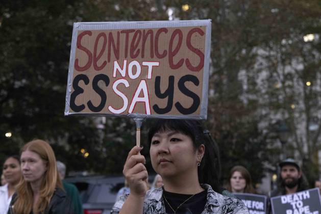 October 8, 2026, New York, New York, USA: A demonstrator holds a sign that reads Sentences NOT Essays joining hundreds at a rally in Foley Square outside the New York State Supreme Court building in Lower Manhattan under the banner . StopSexualViolence: From the Frat House to the White House. The protest is one of many rallies and campus walkouts around the country demanding justice for Cornell s Jane Doe. New York USA - ZUMAr174 20261008_znp_r174_008 Copyright: xGinaxMxRandazzox