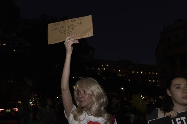 October 8, 2026, New York, New York, USA: A demonstrator holds a sign that reads Does my outfit entitle you to RAPE me? joining hundreds at a rally in Foley Square outside the New York State Supreme Court building in Lower Manhattan under the banner . StopSexualViolence: From the Frat House to the White House. The protest is one of many rallies and campus walkouts around the country demanding justice for Cornell s Jane Doe. New York USA - ZUMAr174 20261008_znp_r174_010 Copyright: xGinaxMxRandazzox