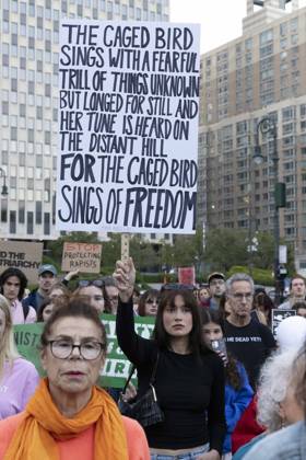 October 8, 2026, New York, New York, USA: A demonstrator holds a sign that reads THE CAGED BIRD SINGS WITH A FEARFUL TRILL OF THINGS UNKNOWN BUT LONGED FOR STILL AND HER TUNE IS HEARD ON THE DISTANT HILL FOR THE CAGED BIRD SINGS OF FREEDOM joining hundreds at a rally in Foley Square outside the New York State Supreme Court building in Lower Manhattan under the banner . StopSexualViolence: From the Frat House to the White House. The protest is one of many rallies and campus walkouts around the country demanding justice for Cornell s Jane Doe. New York USA  - ZUMAr174 20261008_znp_r174_036 Copyright: xGinaxMxRandazzox