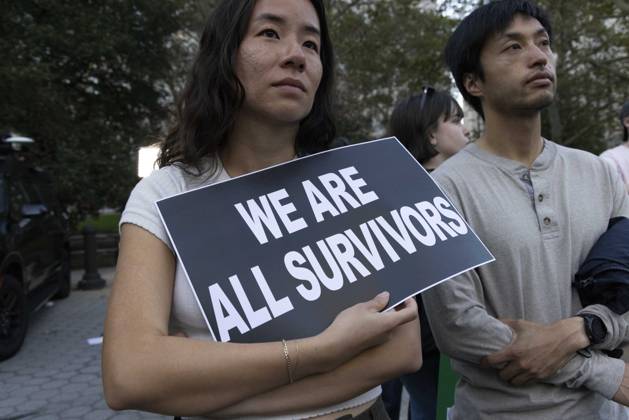 October 8, 2026, New York, New York, USA: A demonstrator holds a sign that reads WE ARE ALL SURVIVORS joining hundreds at a rally in Foley Square outside the New York State Supreme Court building in Lower Manhattan under the banner . StopSexualViolence: From the Frat House to the White House. The protest is one of many rallies and campus walkouts around the country demanding justice for Cornell s Jane Doe. New York USA - ZUMAr174 20261008_znp_r174_025 Copyright: xGinaxMxRandazzox