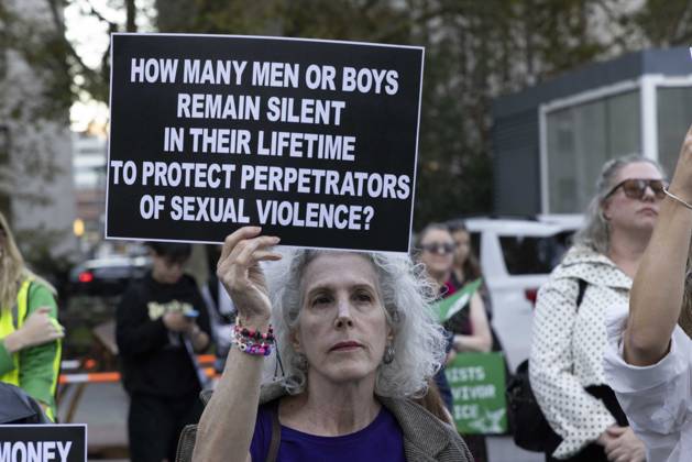 October 8, 2026, New York, New York, USA: A demonstrator holds a sign that reads HOW MANY MEN OR BOYS REMAIN SILENT IN THEIR LIFETIME TO PROTECT PERPETRATORS OF SEXUAL VIOLENCE? joining hundreds at a rally in Foley Square outside the New York State Supreme Court building in Lower Manhattan under the banner . StopSexualViolence: From the Frat House to the White House. The protest is one of many rallies and campus walkouts around the country demanding justice for Cornell s Jane Doe. New York USA - ZUMAr174 20261008_znp_r174_027 Copyright: xGinaxMxRandazzox
