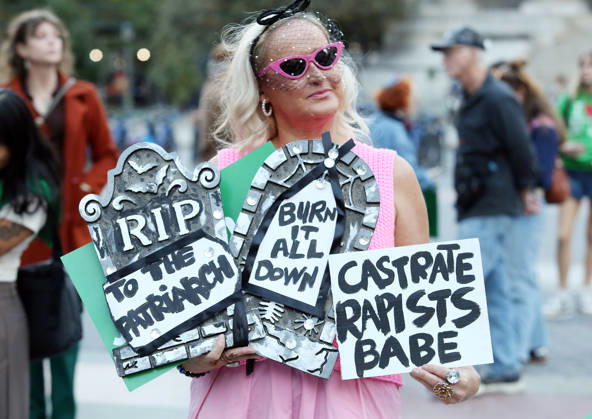October 8, 2026, New York City, New York, USA: A woman holds signs that say, RIP to the Patriarch , Burn it all down , and Castrate Rapists Babe . A demonstration of several hundred people, mostly women, showed support for Cornell student Jane Doe , who sued after a 2024 gang rape. The protestors gathered at Foley Square and called for tougher action against sexual violence. New York City USA - ZUMAk45_ 20261008_zaf_k45_013 Copyright: xKristaxKennellx