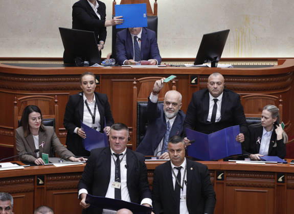 Albanian Parliament Vote the Territorial Reform in Tirana, Albania. Bodyguards try to protect Albanian Prime Minister Edi Rama (C) as an opposition MP throws a water bottle during a parliamentary session where a government s proposed administrative and territorial reform is voted on in Tirana, Albania, early on October 9, 2026. Light Studio Agency Malton Dibra Tirana Albania Copyright: xLightxStudioxAgencyx xMaltonxDibrax