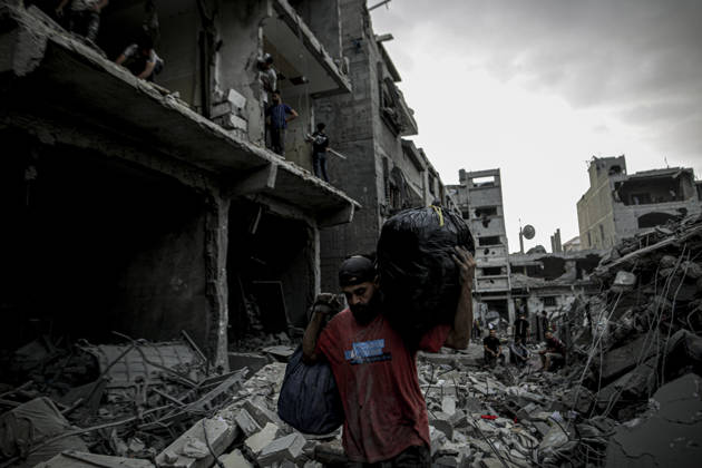 Israeli army continues its attacks on Gaza despite the ceasefire GAZA CITY, PALESTINE - OCTOBER 9: Palestinian civilians and emergency responders search through the debris of damaged residential buildings following an Israeli military airstrike in the Sabra neighborhood, south of Gaza City, Palestine on October 9, 2026. Multiple dead and wounded, including women and children, were reported as rescue teams worked under severe resource shortages to extract survivors from beneath destroyed structures. Saeed M. M. T. Jaras Anadolu Gaza City Gaza. Editorial use only. Please get in touch for any other usage.  Copyright: x2026xAnadoluxSaeedxM.xM.xT.xJarasx