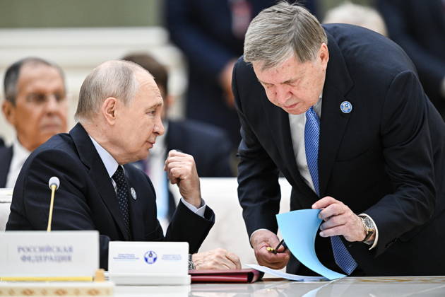 TURKMENISTAN, BALKAN PROVINCE - OCTOBER 9, 2026: Russia s President Vladimir Putin (L) and his adviser Yuri Ushakov during a narrow-format meeting of the CIS Council of Heads of State in Turkmenbashi Turkmenistan  - ZUMAt113 20261009_zaa_t113_140 Copyright: xSergeixBobylevx