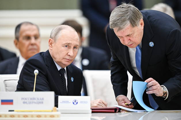 TURKMENISTAN, BALKAN PROVINCE - OCTOBER 9, 2026: Russia s President Vladimir Putin (L) and his adviser Yuri Ushakov during a narrow-format meeting of the CIS Council of Heads of State in Turkmenbashi Turkmenistan  - ZUMAt113 20261009_zaa_t113_139 Copyright: xSergeixBobylevx