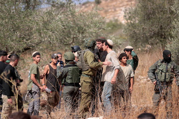 Clashes erupt between Israeli settlers and Palestinian farmers in West Bank RAMALLAH, WEST BANK - OCTOBER 9: Clashes break out between Israeli settlers, accompanied by Israeli soldiers, and Palestinian farmers harvesting olives in the town of Deir Ibzi, near Ramallah in West Bank, on October 9, 2026. The incident reportedly involved damage to olive crops and provocative actions by the settlers. Issam Rimawi Anadolu Ramallah West Bank. Editorial use only. Please get in touch for any other usage.  Copyright: x2026xAnadoluxIssamxRimawix
