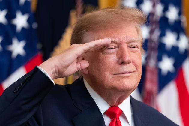 President Donald Trump salutes during the National Anthem during an event in the East Room of the White House in Washington, DC on Friday, Oct. 9, 2026. Trump is hosting a Columbus Day celebration.  WASP20261009131 AaronxSchwartz
