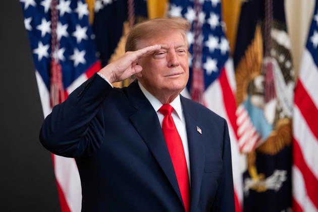 President Donald Trump salutes during the National Anthem during an event in the East Room of the White House in Washington, DC on Friday, Oct. 9, 2026. Trump is hosting a Columbus Day celebration.  WASP20261009132 AaronxSchwartz