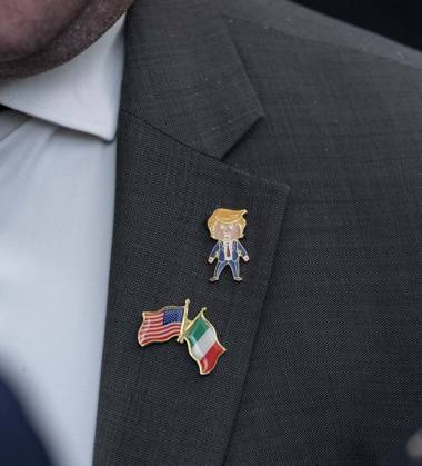 October 9, 2026, Washington, District Of Columbia, USA: An unidentified guest wears a Trump lapel pin as United States President Donald J Trump hosts a Columbus Day Celebration in the East Room of the White House in Washington, DC, USA on Friday, October 8, 2026 Washington USA - ZUMAs152 20261009_faa_s152_010 Copyright: xAndrewxThomas-CNPx