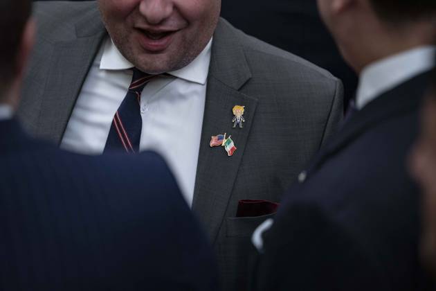 October 9, 2026, Washington, District Of Columbia, USA: An unidentified guest wears a Trump lapel pin as United States President Donald J Trump hosts a Columbus Day Celebration in the East Room of the White House in Washington, DC, USA on Friday, October 8, 2026 Washington USA - ZUMAs152 20261009_faa_s152_019 Copyright: xAndrewxThomas-CNPx