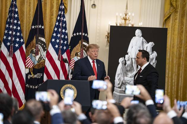 United States President Donald J Trump greets singer Christopher Macchio as he hosts a Columbus Day Celebration in the East Room of the White House in Washington, DC, USA on Friday, October 8, 2026. Copyright: xAaronxSchwartz PoolxviaxCNPx MediaPunchx