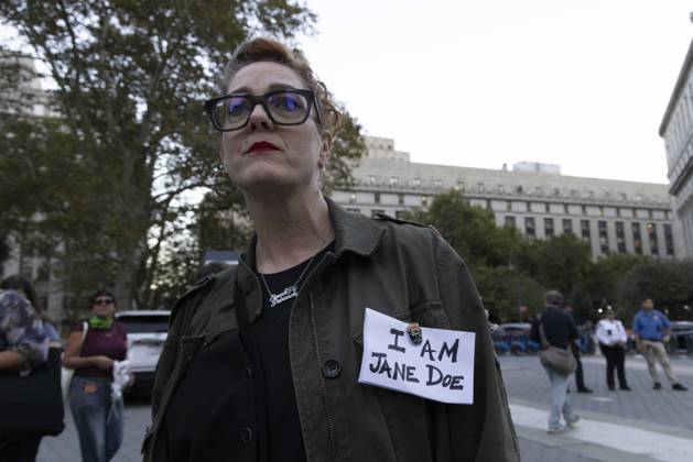 October 8, 2026, New York, New York, USA: A demonstrator wears a sign pinned to their jacket that reads I AM JANE DOE joining hundreds at a rally in Foley Square outside the New York State Supreme Court building in Lower Manhattan under the banner . StopSexualViolence: From the Frat House to the White House. The protest is one of many rallies and campus walkouts around the country demanding justice for Cornell s Jane Doe. New York USA - ZUMAr174 20261008_znp_r174_061 Copyright: xGinaxMxRandazzox