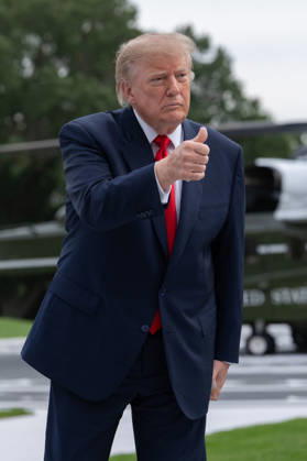 President Donald Trump gives a thumbs up to members of the media on the South Lawn of the White House before boarding Marine One in Washington, DC on Friday, Oct. 9, 2026. Trump is heading to Syracuse on Friday to boost Republican gubernatorial candidate Bruce Blakeman, who is trailing Governor Kathy Hochul in polls ahead of November s election.  WASP20261009153 AaronxSchwartz
