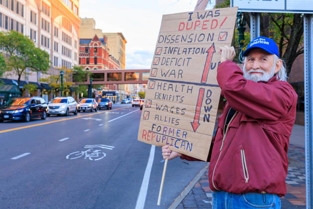 October 9, 2026, Syracuse, Ny, USA: A man who identifies as a former republican holds up his sign during the protest against the Trump rally held at the Oncenter. Syracuse USA  - ZUMAh195 20261009_znp_h195_006 Copyright: xAlexxHamerx