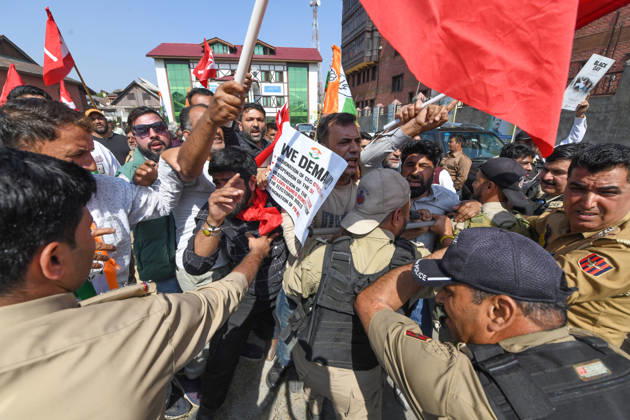 October 10, 2026, Srinagar, Jammu And Kashmir, India: Police personnel try to stop supporters of the opposition alliance INDIA bloc (Indian National Developmental Inclusive Alliance) during a protest demanding the resignation of India s Chief Election Commissioner Gyanesh Kumar over alleged voter roll irregularities linked to the special intensive revision (SIR), in Srinagar on October 10, 2026. Srinagar India  - ZUMAz120 20261010_zip_z120_001 Copyright: xBasitxZargarx
