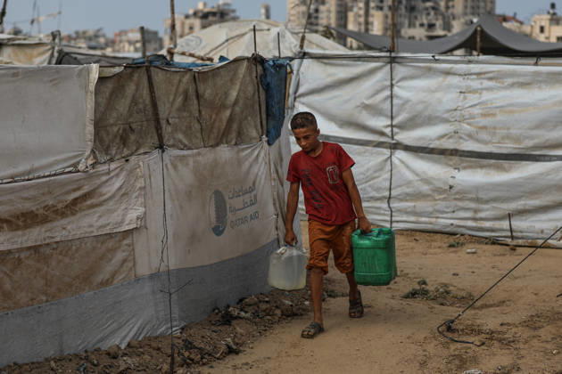 Palestinians still lack basic necessities amid Israel attacks DEIR AL BALAH, GAZA, PALESTINE - OCTOBER 10: Palestinians living in tents set up in the Bureij area carry water in containers to their makeshift shelters in Deir al Balah, Gaza, Palestine on October 10, 2026.The humanitarian crisis in the region continues to deepen, with thousands of displaced families struggling to survive without access to the most basic necessities. Adam Bilal Anadolu Deir al Balah Gaza. Editorial use only. Please get in touch for any other usage.  Copyright: x2026xAnadoluxAdamxBilalx