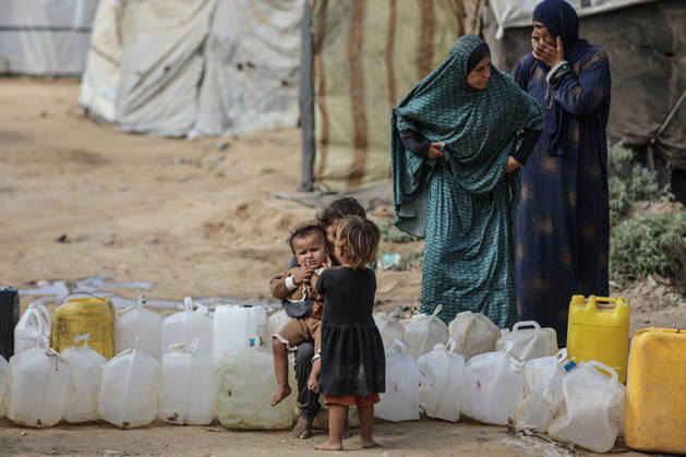 Palestinians still lack basic necessities amid Israel attacks DEIR AL BALAH, GAZA, PALESTINE - OCTOBER 10: Palestinians living in tents set up in the Bureij area carry water in containers to their makeshift shelters in Deir al Balah, Gaza, Palestine on October 10, 2026.The humanitarian crisis in the region continues to deepen, with thousands of displaced families struggling to survive without access to the most basic necessities. Adam Bilal Anadolu Deir al Balah Gaza. Editorial use only. Please get in touch for any other usage.  Copyright: x2026xAnadoluxAdamxBilalx