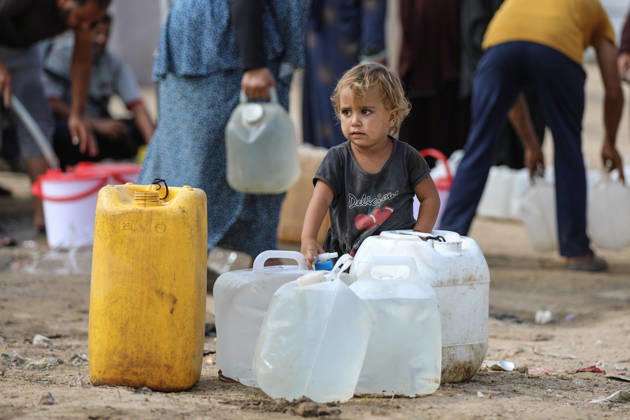 Palestinians still lack basic necessities amid Israel attacks DEIR AL BALAH, GAZA, PALESTINE - OCTOBER 10: Palestinians living in tents set up in the Bureij area carry water in containers to their makeshift shelters in Deir al Balah, Gaza, Palestine on October 10, 2026.The humanitarian crisis in the region continues to deepen, with thousands of displaced families struggling to survive without access to the most basic necessities. Adam Bilal Anadolu Deir al Balah Gaza. Editorial use only. Please get in touch for any other usage.  Copyright: x2026xAnadoluxAdamxBilalx