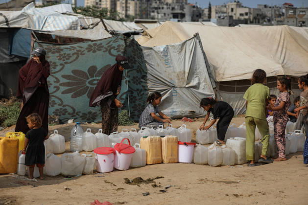 Palestinians still lack basic necessities amid Israel attacks DEIR AL BALAH, GAZA, PALESTINE - OCTOBER 10: Palestinians living in tents set up in the Bureij area carry water in containers to their makeshift shelters in Deir al Balah, Gaza, Palestine on October 10, 2026.The humanitarian crisis in the region continues to deepen, with thousands of displaced families struggling to survive without access to the most basic necessities. Adam Bilal Anadolu Deir al Balah Gaza. Editorial use only. Please get in touch for any other usage.  Copyright: x2026xAnadoluxAdamxBilalx