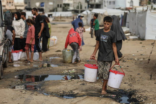 Palestinians still lack basic necessities amid Israel attacks DEIR AL BALAH, GAZA, PALESTINE - OCTOBER 10: Palestinians living in tents set up in the Bureij area carry water in containers to their makeshift shelters in Deir al Balah, Gaza, Palestine on October 10, 2026.The humanitarian crisis in the region continues to deepen, with thousands of displaced families struggling to survive without access to the most basic necessities. Adam Bilal Anadolu Deir al Balah Gaza. Editorial use only. Please get in touch for any other usage.  Copyright: x2026xAnadoluxAdamxBilalx