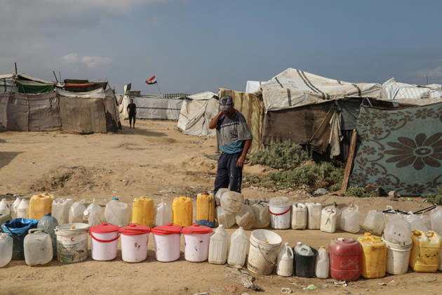 Palestinians still lack basic necessities amid Israel attacks DEIR AL BALAH, GAZA, PALESTINE - OCTOBER 10: Palestinians living in tents set up in the Bureij area carry water in containers to their makeshift shelters in Deir al Balah, Gaza, Palestine on October 10, 2026.The humanitarian crisis in the region continues to deepen, with thousands of displaced families struggling to survive without access to the most basic necessities. Adam Bilal Anadolu Deir al Balah Gaza. Editorial use only. Please get in touch for any other usage.  Copyright: x2026xAnadoluxAdamxBilalx