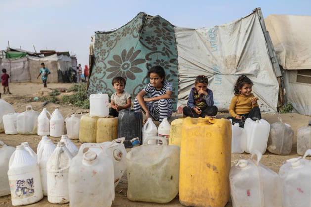 Palestinians still lack basic necessities amid Israel attacks DEIR AL BALAH, GAZA, PALESTINE - OCTOBER 10: Palestinians living in tents set up in the Bureij area carry water in containers to their makeshift shelters in Deir al Balah, Gaza, Palestine on October 10, 2026.The humanitarian crisis in the region continues to deepen, with thousands of displaced families struggling to survive without access to the most basic necessities. Adam Bilal Anadolu Deir al Balah Gaza. Editorial use only. Please get in touch for any other usage.  Copyright: x2026xAnadoluxAdamxBilalx
