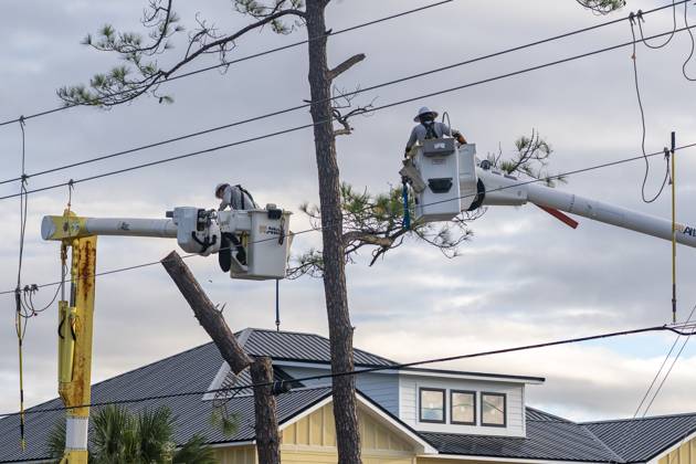 October 10, 2026, Orange Beach, Al, USA: Crews work to repair power lines after a tree fell on them as Hurricane Isaias came ashore..Hurricane Isaias made landfall Friday, October 9 along the U.S. Gulf coast. Orange Beach USA - ZUMAs197 20261010_aaa_s197_003 Copyright: xJenxGolbeckx