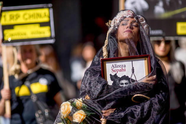 October 10, 2026, Madrid, Spain: A woman holds a portrait, wearing a veil on her head during a rally against the death penalty in Callao Square in central Madrid. World Day Against the Death Penalty has been observed every October 10th since 2003. Madrid Spain  - ZUMAs197 20261010_aaa_s197_022 Copyright: xLuisxSotox