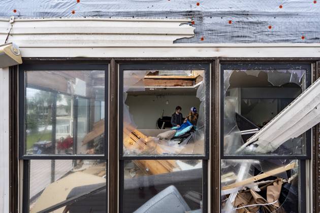 October 10, 2026, Pensacola Beach, Fl, USA: Laura and Alex Dean clean out their home that was severely damaged during Hurricane Isaias..Hurricane Isaias made landfall Friday, October 9 along the U.S. Gulf coast. Pensacola Beach USA  - ZUMAs197 20261010_aaa_s197_031 Copyright: xJenxGolbeckx