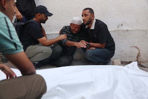 Palestinians Mourn Victims of Israeli Attack in Gaza City Palestinians mourn beside the bodies of their loved ones at al-Shifa Hospital in Gaza City, on October 10, 2026, after they were killed in an Israeli attack. The attack comes as the Israeli army continues its strikes across the Gaza Strip despite a ceasefire. Photo by Mohammed Salha apaimages Gaza Gaza Strip Palestinian Territory 101026_Gaza_MS_00(1) Copyright: xapaimagesxMohammedxSalhax xapaimagesx