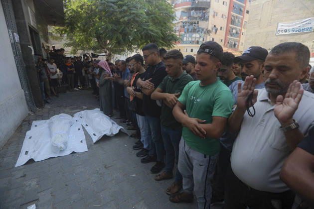 Gaza Palestine Airstrike Aftermath Mourners perform prayers a shrouded body outside Al-Shifa Hospital in Gaza City, Palestine on October 10, 2026. Four Palestinians were killed in an air strike near Panda Mall, and people carried the victims toward Al-Shifa Hospital for funeral prayers. Gaza Gaza Strip Palestinian Territories Copyright: xIbrahimxZanounx