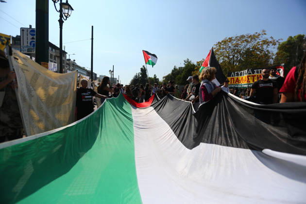 October 10, 2026, Athens, Attica, GREECE: Demonstrators carry a large Palestinian flag during a march in solidarity with the Palestinian people. Athens GREECE - ZUMAx103 20261010_zip_x103_001 Copyright: xHarrisxXanthopoulosx