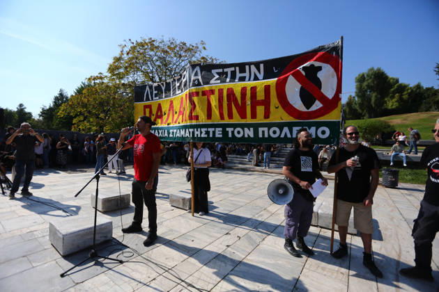 October 10, 2026, Athens, Attica, GREECE: A speaker addresses protesters beneath a large banner calling for freedom for Palestine and an end to the war. Athens GREECE  - ZUMAx103 20261010_zip_x103_003 Copyright: xHarrisxXanthopoulosx