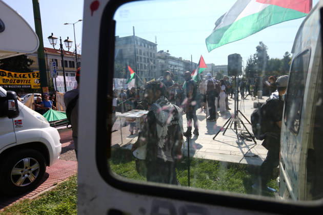 October 10, 2026, Athens, Attica, GREECE: A pro-Palestinian demonstration is seen through the window of a parked vehicle as protesters gather with Palestinian flags and banners. Athens GREECE - ZUMAx103 20261010_zip_x103_004 Copyright: xHarrisxXanthopoulosx