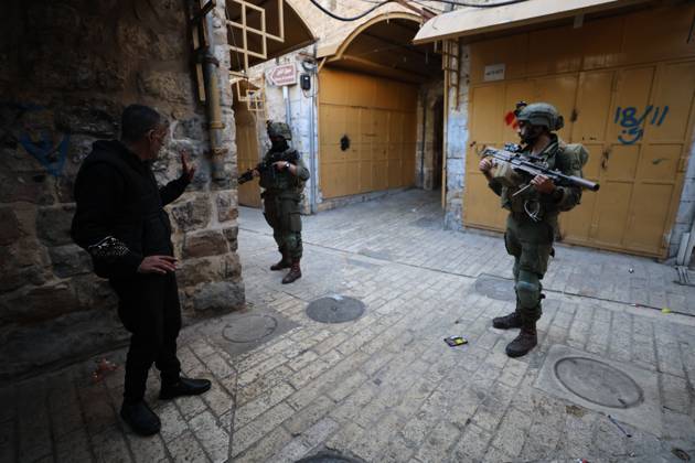 Israeli settlers enter Hebron Old City under military protection HEBRON, OCCUPIED WEST BANK, OCTOBER 10, 2026: Israeli settlers enter Hebron s Old City under the protection of Israeli forces during an organized visit to the area. Israeli soldiers deployed along streets and around the group as settlers moved through the Old City, where Israeli settlers and Palestinian residents live in close proximity amid longstanding tensions and movement restrictions. HEBRON Palestine, State of Copyright: x xMosabxshawerx xJNAxPressx